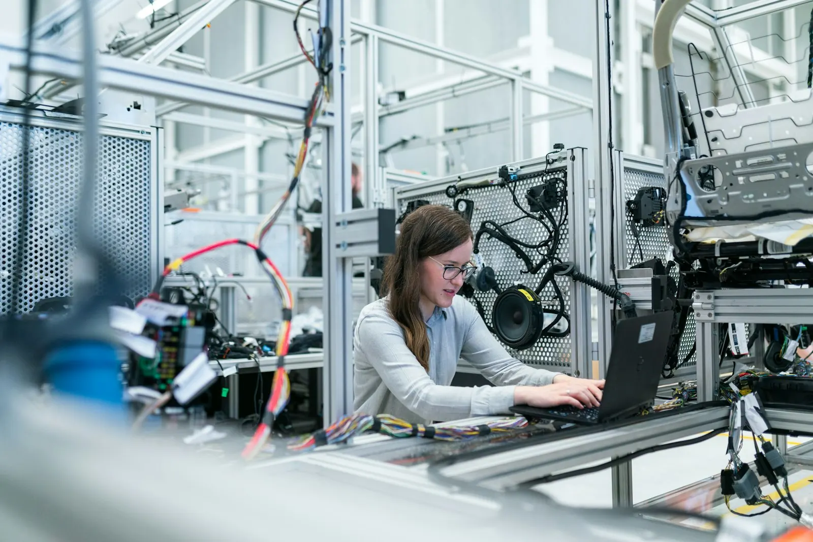 Engineer working at an automated manufacturing line