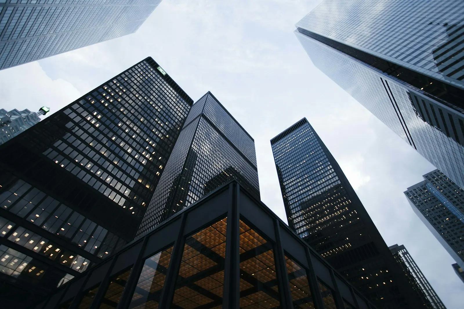 Looking up at modern glass skyscrapers