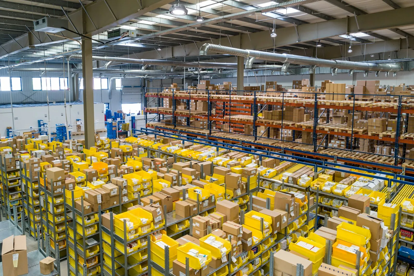 Large warehouse with rows of stacked boxes
